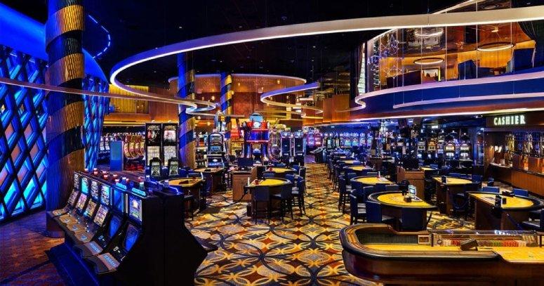 Custom installations of Lightnet's Liquid Line suspension light created by Kasian and Ombrages create a flow of energy through a section of Grand Villa Casino in Edmonton.