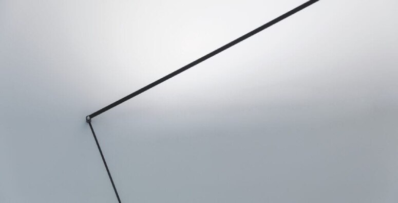 A close up of the pivot point and arm of Meridiana wall light, designed for Davide Groppi by Davide Groppi.