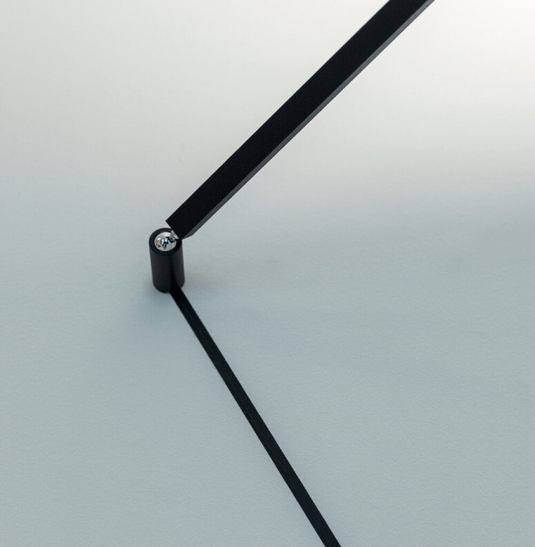 A detail shot of Meridiana wall light's pivot point and the Endless conductive strip leading into it.